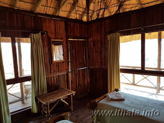 Rustic bedroom interior at Mhlangeni Bush Camp in Ithala Game Reserve