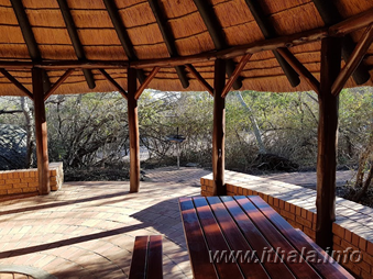 Covered outdoor patio and braai area at a Ntshondwe Camp chalet