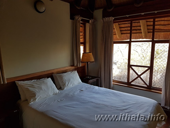 Double bedroom in a two-sleeper self-catering chalet at Ntshondwe Camp