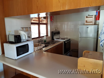 Equipped kitchen in a two-sleeper self-catering chalet at Ntshondwe Camp