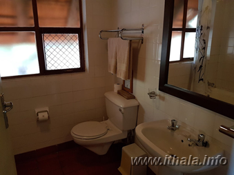 Bathroom inside a four-sleeper chalet at Ntshondwe Camp in Ithala Game Reserve