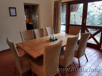 Dining area in a six-bed self-catering chalet at Ntshondwe Camp