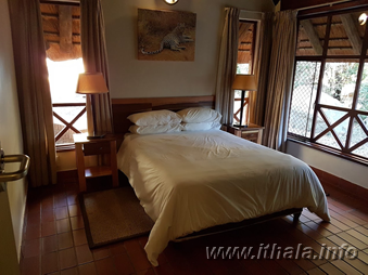 Double bedroom in a six-bed self-catering chalet at Ntshondwe Camp