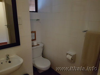 Private bathroom with toilet inside a six-bed chalet at Ntshondwe Camp