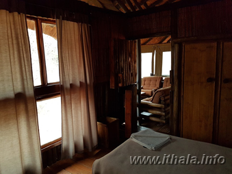 Rustic wooden bedroom interior at Mbizo Bush Camp