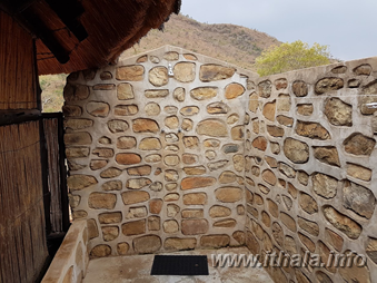 Private outdoor shower with stone walls at Mbizo Bush Camp in Ithala Game Reserve
