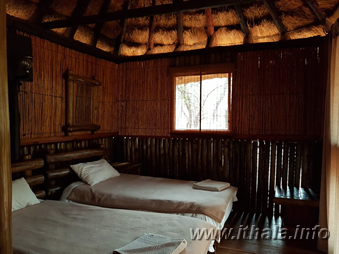 Twin bedroom with two single beds inside Mbizo Bush Camp