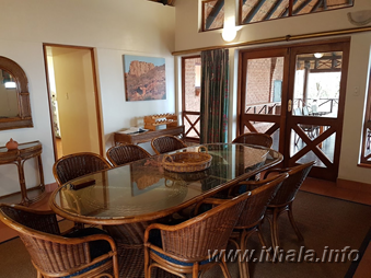 Open-plan dining and living area inside Ntshondwe Lodge